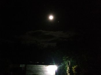 Low angle view of moon in sky at night