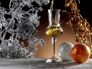 Close-up of christmas decoration on glass table