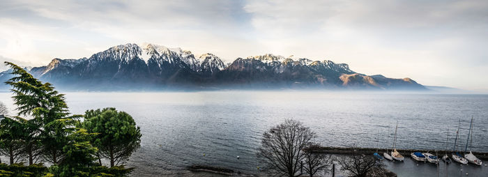 Scenic view of lake against sky during winter