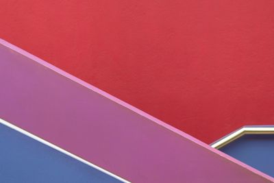 High angle view of pink umbrella against wall