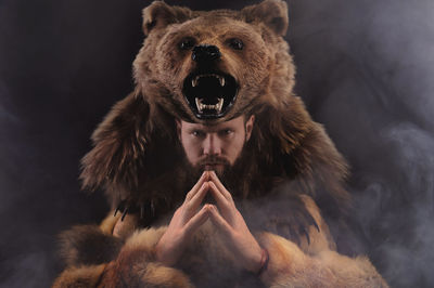 Portrait of man with bear costume