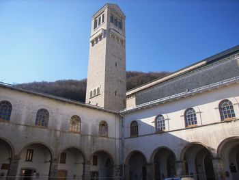 Low angle view of historic building against clear blue sky