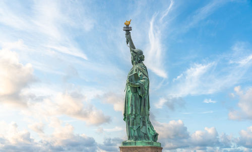 Low angle view of statue against sky