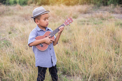 Full length of a boy playing with ball