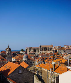 Townscape against clear blue sky