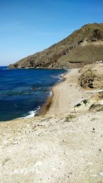 View of coastal feature against clear blue sky