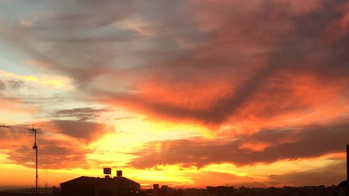 Low angle view of cloudy sky at sunset