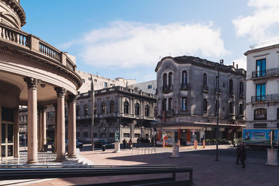 Buildings in city against sky