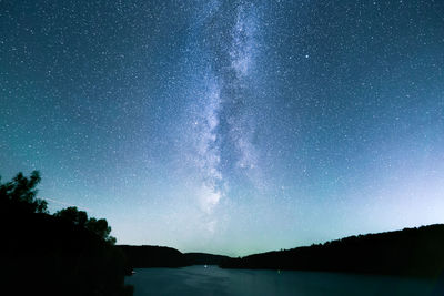 Scenic view of star field against sky at night