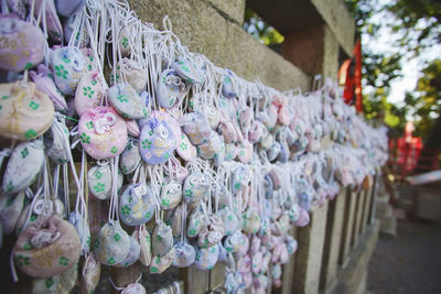 Multi colored decorations hanging at market stall