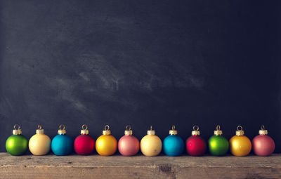 Close-up of multi colored baubles on table