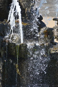 Close-up of water splashing on rocks