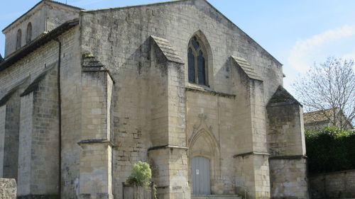 Low angle view of old building against sky