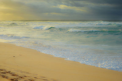 View of calm beach against the sky