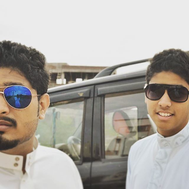 young adult, sunglasses, headshot, young men, lifestyles, portrait, person, looking at camera, leisure activity, transportation, head and shoulders, front view, mid adult men, close-up, mode of transport, smiling, car, mid adult