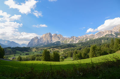 Scenic view of landscape and mountains against sky