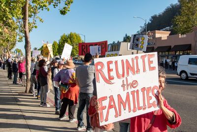 People on street in city protesting 