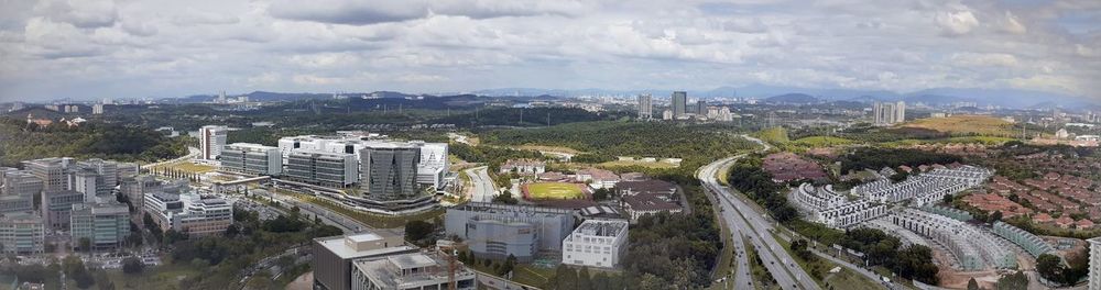 High angle view of buildings in city against sky