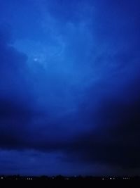 Low angle view of dramatic sky at night