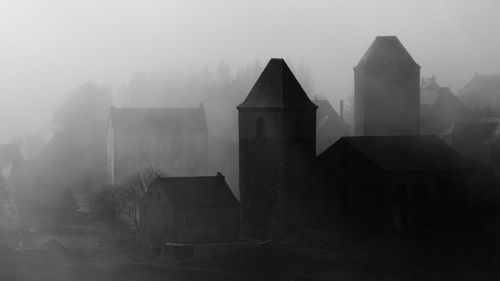 Buildings against sky during winter