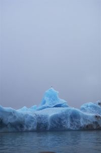 Scenic view of frozen lake against sky