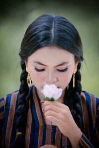 Close-up of young woman drinking water