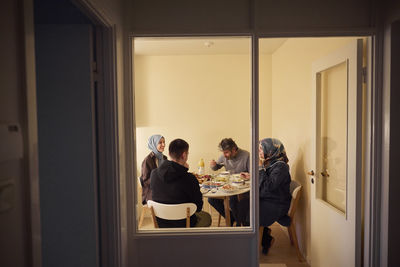 Family eating dinner together at home