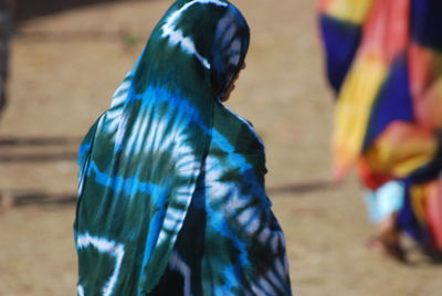 Rear view of women walking outdoors