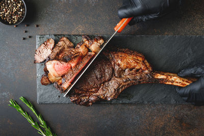 High angle view of meat on barbecue grill