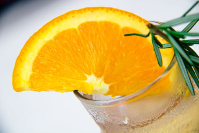Close-up of orange fruit against white background