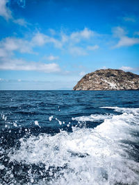 Scenic view of sea against blue sky