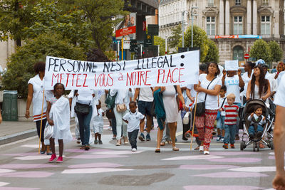 People on road in city