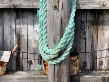 Close-up of rope on wooden wall