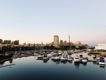 Reflection of buildings in city at waterfront