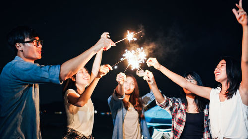 People enjoying music concert at night