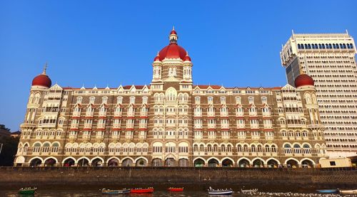 Low angle view of historical building against blue sky