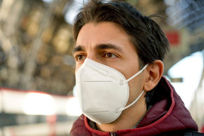 Man wearing mask standing outdoors