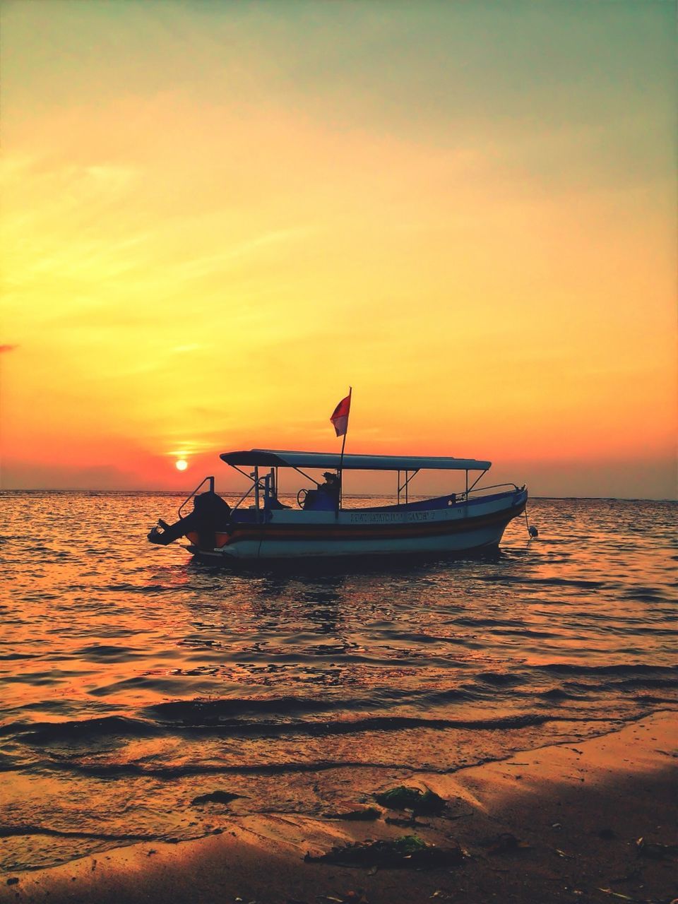 sunset, sea, water, orange color, nautical vessel, transportation, boat, horizon over water, mode of transport, scenics, beauty in nature, sky, tranquil scene, tranquility, silhouette, sun, nature, idyllic, beach, waterfront