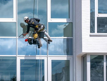 People working in glass building