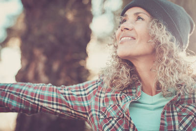 Smiling woman wearing knit hat