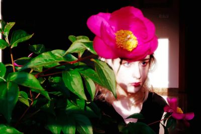 Portrait of woman with pink roses