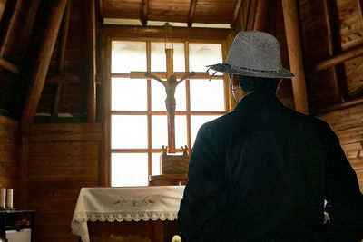 Rear view of man standing in church