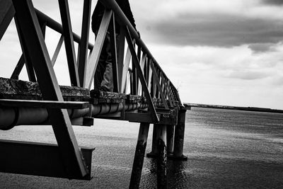 Bridge over sea against sky