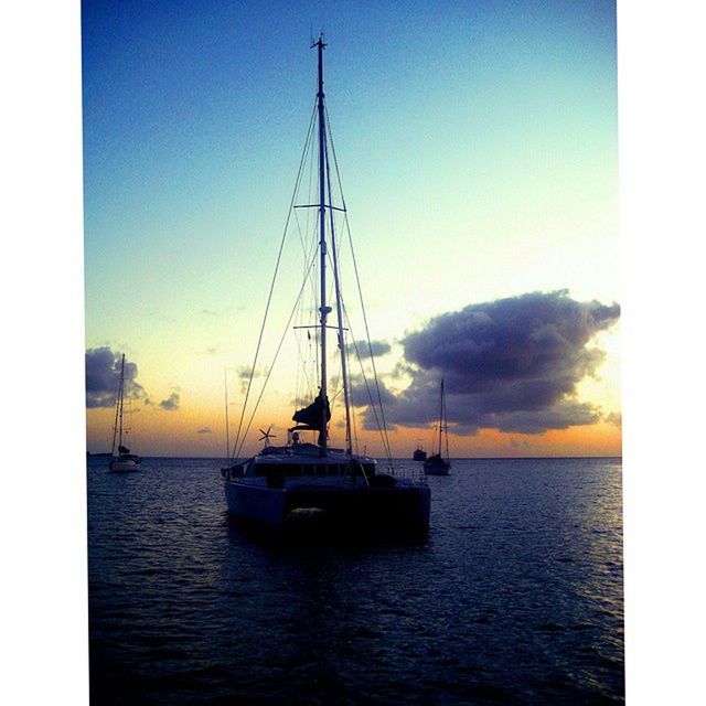 nautical vessel, transportation, boat, sea, mode of transport, water, sunset, waterfront, sky, horizon over water, sailboat, sailing, transfer print, beauty in nature, scenics, tranquility, mast, tranquil scene, auto post production filter, nature