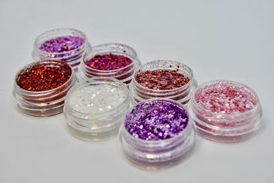 Close-up of multi colored glass jar on table