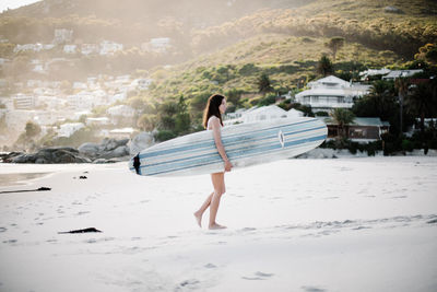 Full length of woman walking on beach