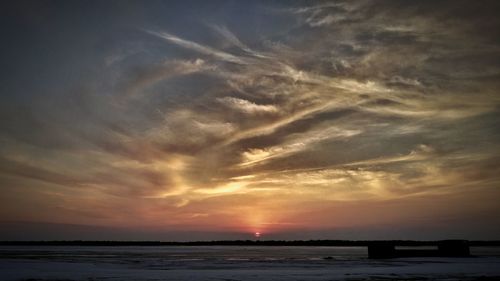 Scenic view of sea against dramatic sky