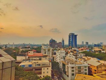 High angle view of buildings against sky during sunset