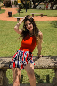 Beautiful young woman standing in park