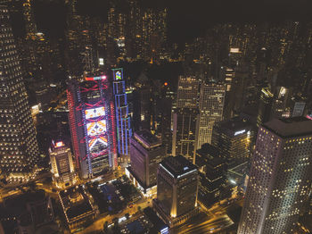 Aerial view of illuminated buildings in city at night